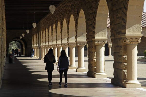 FILE - In this March 14, 2019, file photo students walk on the Stanford University campus in Santa Clara, Calif. A new study from the State Department and the Institute of International Education finds that international students in the U.S. grew by 12% in the 2022-23 academic year, the largest jump in more than 40 years. More than 1 million students came from abroad, the most since the 2019-20 school year. (AP Photo/Ben Margot, File)