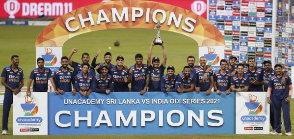 Members of the Indian cricket team poses for photographers wit the winner's trophy after defeating Sri Lanka by 2-1 in their one day international cricket match series in Colombo, Sri Lanka, Friday, July 23, 2021. (AP Photo/Eranga Jayawardena)