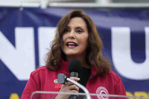 FILE - Michigan Gov. Gretchen Whitmer speaks to United Auto Workers members at a rally, Sept. 15, 2023, in Detroit. On Monday, Nov. 20, Whitmer signed legislation that prohibits individuals convicted of a misdemeanor that involved domestic violence from possessing firearms for at least an eight-year period. State law currently includes firearm restrictions for those with felonies related to domestic abuse, but no law had existed for misdemeanor domestic violence. (AP Photo/Paul Sancya, File)