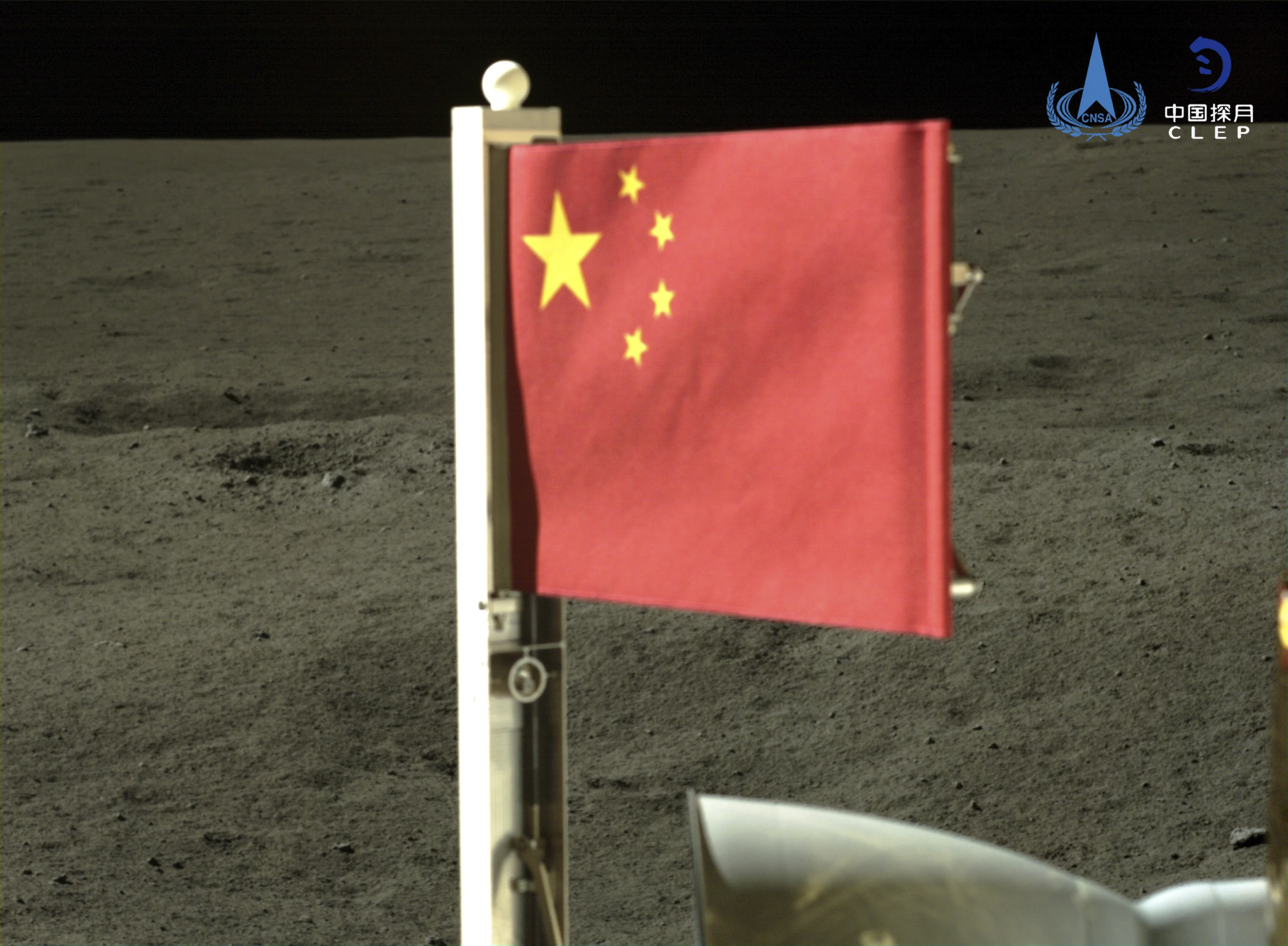 Craft Unfurls China’s Flag on the Far Side of the Moon and Lifts Off with Lunar Rocks to Bring Home