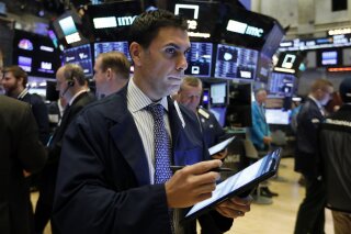 FILE - In this Feb. 6, 2020, file photo trader Craig Spector works on the floor of the New York Stock Exchange. The U.S. stock market opens at 9:30 a.m. EST on Wednesday, Feb. 12. (AP Photo/Richard...