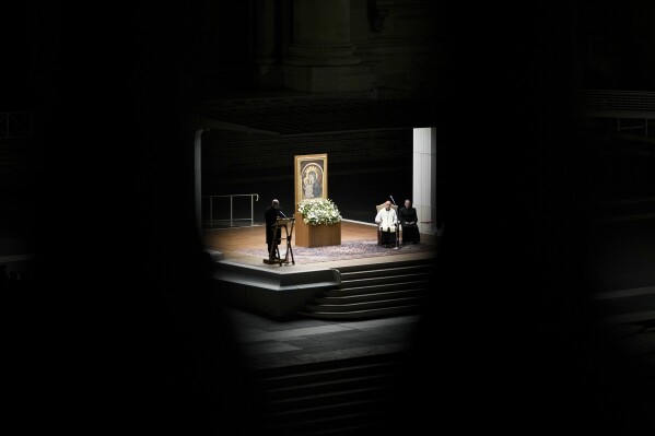 Cardinal Victor Manuel Fernandez, second from right, leads a rosary prayer for Pope Francis' health in St. Peter's Square at the Vatican, Friday, Feb. 28, 2025. (AP Photo/Andrew Medichini)