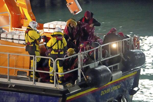 A group of people thought to be migrants are brought in to Dover, England by the RNLI, following a small boat incident in the English Channel, Thursday Nov. 25, 2021. On Wednesday around 30 migrants bound for Britain died when their boat sank in the English Channel, in what France’s interior minister called the biggest migration tragedy on the dangerous crossing to date. (Gareth Fuller/PA via AP)