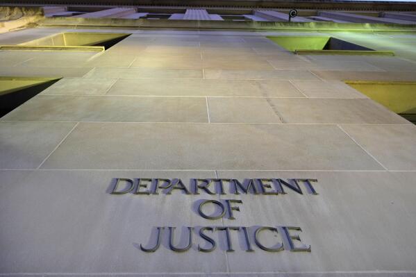 FILE - In this May 14, 2013, file photo, the Department of Justice headquarters building in Washington is photographed early in the morning. CNN says the Trump administration Justice Department secretly obtained the 2017 phone records of CNN correspondent Barbara Starr. (AP Photo/J. David Ake, File)