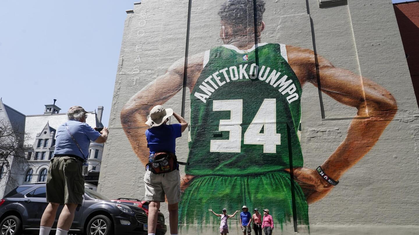 Teddy Gonzales takes a selfie in front of mural of Milwaukee Bucks' Giannis  Antetokounmpo painted on the side of a building Thursday, May 12, 2022, in  Milwaukee. The mural will be dedicated