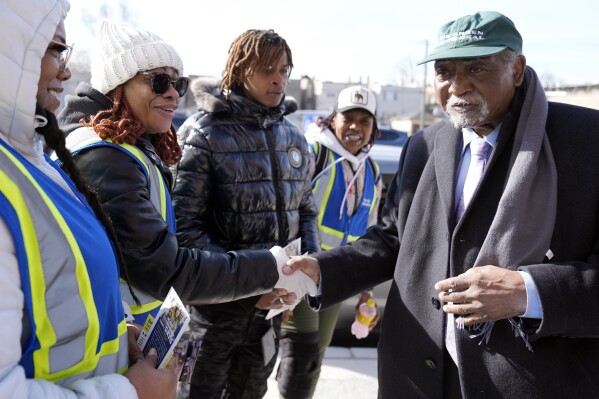 Danny Davis, right, who is the U.S. representative from Illinois's 7th congressional district, greets supporters outside Sankofa Cultural Arts & Business center in Chicago, Tuesday, March 19, 2024. Illinois residents will vote Tuesday to narrow Democratic and GOP candidate fields in key U.S. House races. (AP Photo/Nam Y. Huh)