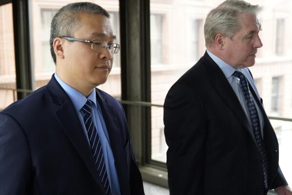 FILE - Former Minneapolis police officer Tou Thao, left, and his attorney Robert Paule arrive for sentencing for violating George Floyd's civil rights outside the Federal Courthouse Wednesday, July 27, 2022, in St. Paul, Minn. A judge has scheduled a hearing for Monday, Aug. 15, 2022, on the status of plea negotiations in the case of the two remaining officers awaiting trial on state charges in the murder of George Floyd. Thao and J. Alexander Kueng face a late October trial. (David Joles/Star Tribune via AP, File)