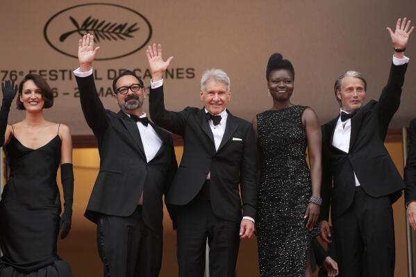 Phoebe Waller-Bridge, from left, director James Mangold, Harrison Ford, Shaunette Renee Wilson, and Mads Mikkelsen pose for photographers upon arrival at the premiere of the film 'Indiana Jones and the Dial of Destiny' at the 76th international film festival, Cannes, southern France, Thursday, May 18, 2023. (Photo by Scott Garfitt/Invision/AP)