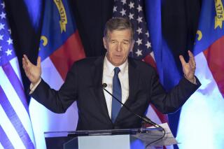 FILE - North Carolina Gov. Roy Cooper speaks at a primary election night event hosted by the North Carolina Democratic Party in Raleigh, N.C., May 17, 2022. Gov. Cooper said Monday, June 20, 2022 that he has tested positive for COVID-19 but is continuing to do work from home while experiencing mild symptoms. Cooper’s office released a statement saying that he has begun taking the antiviral pill Paxlovid to treat the virus. (AP Photo/Ben McKeown, file)