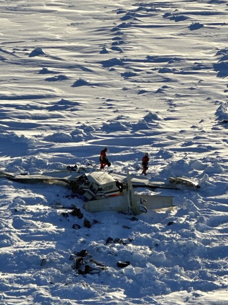This photo provided by the U.S. Coast Guard on Friday, Feb. 7, 2025, shows a small commuter plane that crashed in western Alaska on a flight that was bound for the hub community of Nome. (U.S. Coast Guard via AP)