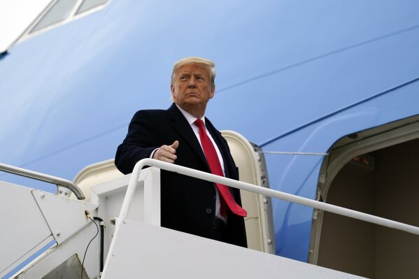FILE - In this Tuesday, Jan. 12, 2021 file photo, President Donald Trump gestures as he boards Air Force One upon arrival at Valley International Airport, in Harlingen, Texas. Iran on Tuesday, Jan. 19, 2021, imposed sanctions on President Donald Trump and a number of members of his administration over their alleged role in support of “terrorism," according to the foreign ministry website. (AP Photo/Alex Brandon, File)