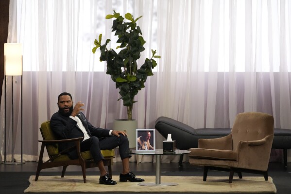 Host Anthony Anderson appears in a reenactment of a scene from "The Sopranos" during the 75th Primetime Emmy Awards on Monday, Jan. 15, 2024, at the Peacock Theater in Los Angeles. (AP Photo/Chris Pizzello)