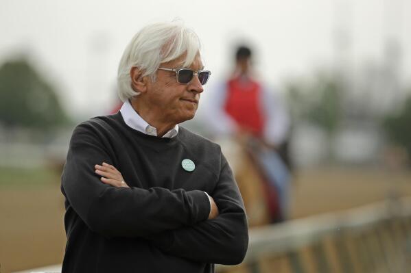 FILE - In this May 1, 2019, file photo, trainer Bob Baffert watches his Kentucky Derby entrant Game Winner during a workout at Churchill Downs in Louisville, Ky. Baffert won't be saddling any horses in the Kentucky Derby this weekend. The winner of a record-tying six Derbies will miss the race for the second straight year while completing a two-year suspension issued by Churchill Downs Inc. (AP Photo/Charlie Riedel, File)