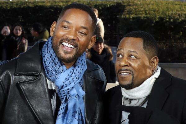 FILE - Co-stars Will Smith, left, and Martin Lawrence appear at a photo call for their film "Bad Boys for Life", in Paris on Jan. 6, 2020. Smith and Lawrence are teaming up for a fourth “Bad Boys” movie, in one of Smith’s most high-profile new projects since he slapped Chris Rock at the Oscars. Sony Pictures announced Tuesday that the untitled “Bad Boys” sequel is in early pre-production. (AP Photo/Thibault Camus, File)