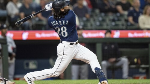 Seattle Mariners' Eugenio Suarez hits a two-run home run off Minnesota Twins relief pitcher Oliver Ortega during the seventh inning of a baseball game, Monday, July 17, 2023, in Seattle. (AP Photo/Stephen Brashear)