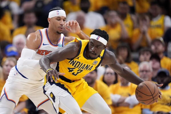 Indiana Pacers forward Pascal Siakam (43) drives around New York Knicks guard Josh Hart, left, during the first half of Game 6 in an NBA basketball second-round playoff series, Friday, May 17, 2024, in Indianapolis. (Ǻ Photo/Michael Conroy)