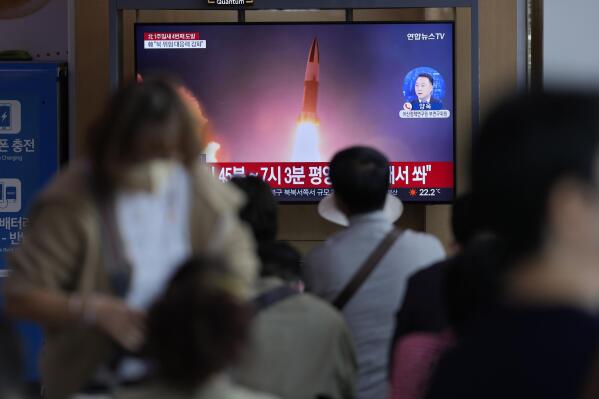 A TV screen showing a news program reporting about North Korea's missile launch with file imagery, is seen at the Seoul Railway Station in Seoul, South Korea, Saturday, Oct. 1, 2022. On Saturday, North Korea fired two short-range ballistic missiles toward its eastern waters, South Korean and Japanese officials said, making it the fourth round of weapons launches this week that are seen as a response to military drills among its rivals. (AP Photo/Lee Jin-man)