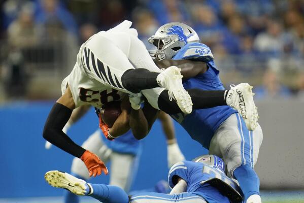 Cincinnati Bengals quarterback Joe Burrow (9) passes against the Detroit  Lions during an NFL fo …