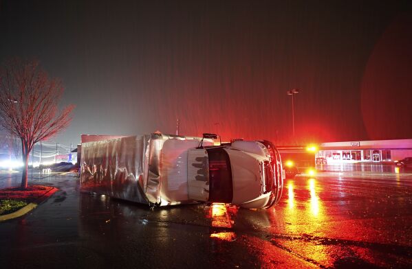 A semitrailer is overturned by an apparent tornado on West Main Street in Hendersonville, Tenn., Saturday, Dec. 9, 2023. (Andrew Nelles/The Tennessean via AP)