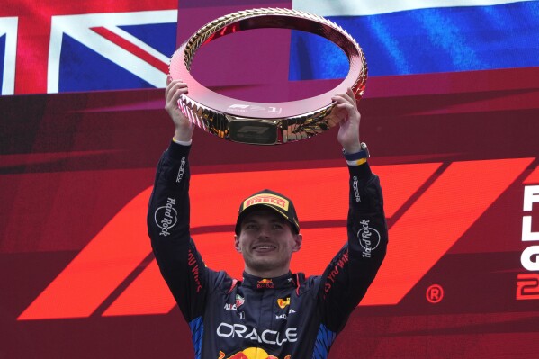 Red Bull driver Max Verstappen of the Netherlands celebrates on the podium after winning the Chinese Formula One Grand Prix at the Shanghai International Circuit, Shanghai, China, Sunday, April 21, 2024. (AP Photo/Andy Wong)