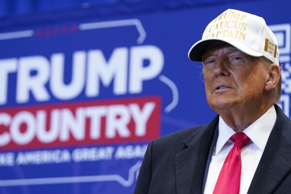 Republican presidential candidate former President Donald Trump arrives to speak at a rally at Simpson College in Indianola, Iowa, Sunday, Jan. 14, 2024. (AP Photo/Andrew Harnik)