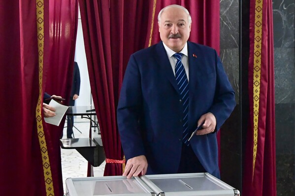 In this photo provided by the Belarusian Presidential Press Service, Belarus President Alexander Lukashenko reacts after voting, at a polling station in Minsk, Belarus, on Sunday, Feb. 25, 2024. Lukashenko was believed a few years ago to be considering whether to lead the new body after stepping down, but his calculus has apparently changed, and he announced on Sunday that he will run in next year's presidential election. (Belarusian Presidential Press Service via AP)