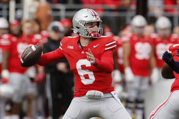 Ohio State quarterback Kyle McCord drops back to pass against Penn State during the first half of an NCAA college football game Saturday, Oct. 21, 2023, in Columbus, Ohio. (AP Photo/Jay LaPrete)