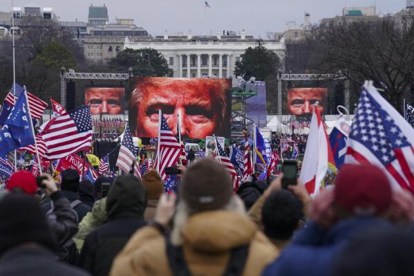 FILE - In this Jan. 6, 2021 file photo, Trump supporters participate in a rally in Washington. Trump is casting the Jan. 6 insurrection at the U.S. Capitol as a patriotic act. As part of this, Trump is attempting to spread suspicions about the circumstances of the death of Ashli Babbitt, who was in the pro-Trump mob that day. (AP Photo/John Minchillo, File)