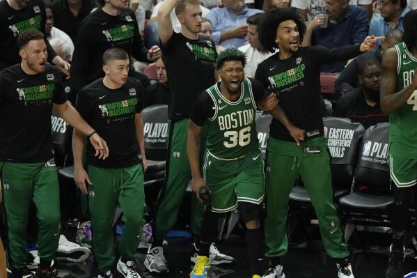 Boston Celtics players cheer during the second half of Game 4 during the NBA basketball playoffs Eastern Conference finals against the Miami Heat, Tuesday, May 23, 2023, in Miami. (AP Photo/Rebecca Blackwell)