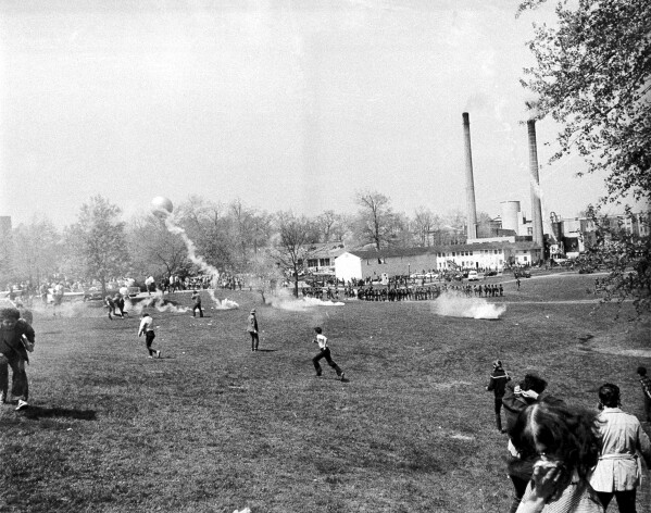 A general view shows tear gas and students during an anti-Vietnam war protest at Kent State University in Kent Ohio, May 4, 1970. U.S. National Guardsmen opened fire during the protests killing four students and wounding five. (AP Photo/Larry Stoddard, File)