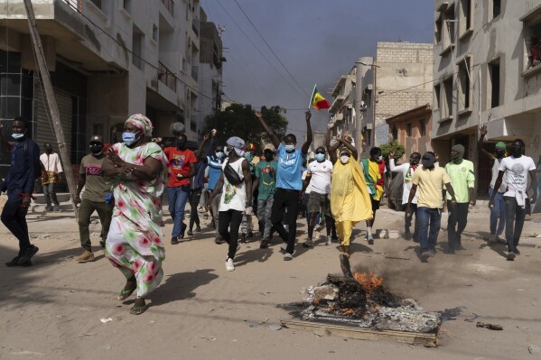 FILE - Demonstrators protest President Macky Sall decision to postpone the Feb. 25 vote, citing an electoral dispute between the parliament and the judiciary regarding some candidacies in Dakar, Senegal, Friday, Feb. 9, 2024. Opposition leaders and candidates rejected the decision, calling it a "coup." Security forces in Senegal have killed at least three people, including a 16-year-old boy, during protests in recent days denouncing the president's decision to delay elections, Amnesty International said Tuesday Feb. 13, 2024. (APPhoto/Stefan Kleinowitz, File)