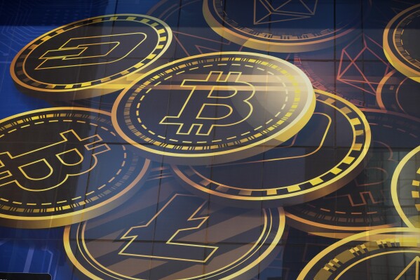 An advertisement for the cryptocurrency, Bitcoin, is displayed on a building in Hong Kong on Nov. 18, 2021. (AP Photo/Kin Cheung, File)