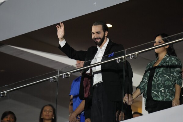 Salvadoran President Nayib Bukele waves during the opening ceremony of the Central American and Caribbean Games, in San Salvador, El Salvador, Friday, June 23, 2023. (AP Photo/Arnulfo Franco)