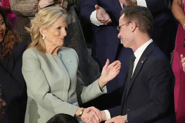 First lady Jill Biden shakes hands with Sweden's Prime Minister Ulf Kristersson, as President Joe Biden delivers the State of the Union address to a joint session of Congress at the U.S. Capitol, Thursday March 7, 2024, in Washington. (AP Photo/Mark Schiefelbein)