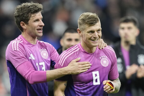 FILE - Germany's Thomas Muller, left, and Germany's Toni Kroos smile after the international friendly soccer match between Germany and Netherlands at the Deutsche Bank Park in Frankfurt, Germany on Tuesday, March 26, 2024. (AP Photo/Martin Meissner, File)