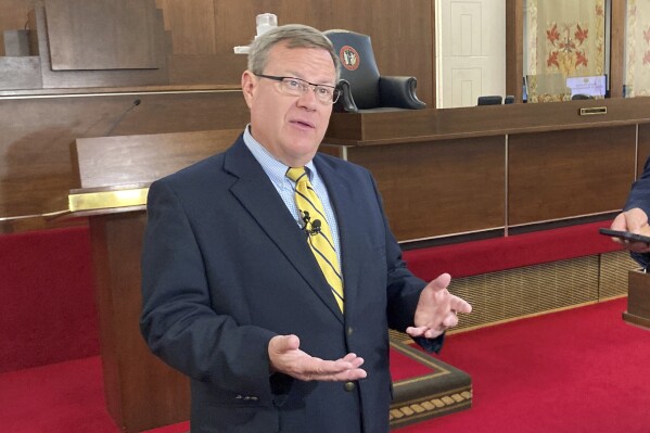 FILE - North Carolina House Speaker Tim Moore, R-Cleveland, speaks with reporters on the House floor of the Legislative Building, July 31, 2023, in Raleigh, N.C. North Carolina Black and Latino voters sued in federal court on Monday, Dec. 4, seeking to strike down congressional districts drawn this fall by Republican state legislators that they argue weaken minority voting power in violation of the U.S. Constitution. Moore, a Republican and one of several lawsuit defendants, said the lawsuit contains baseless “allegations” and a “desperate attempt to throw chaos into North Carolina’s elections, on the first day of candidate filing no less.” (AP Photo/Gary D. Robertson, File)