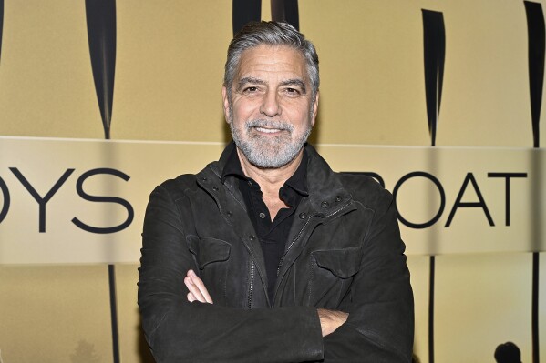FILE - George Clooney attends a special screening of "The Boys in the Boat" in New York on Dec. 13, 2023. Clooney will make his Broadway acting debut next year in a familiar project for the Hollywood star: “Good Night, and Good Luck.” Clooney will play legendary TV journalist Edward R. Murrow in a stage adaptation of the 2005 movie. (Photo by Evan Agostini/Invision/AP, File)