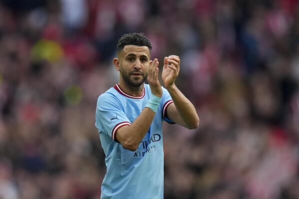 Manchester City's Riyad Mahrez greets fans at the end of the English FA Cup semi final soccer match between Manchester City and Sheffield United at Wembley stadium, in London, Saturday, April 22, 2023. (AP Photo/Alastair Grant)