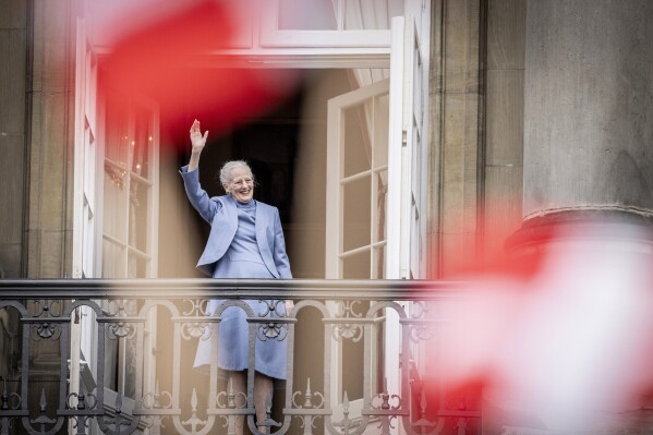 FILE - Denmark's Queen Margrethe II waves from the balcony during celebrations for her 83rd birthday, at Amalienborg Castle in Copenhagen, Sunday, April 16, 2023. Queen Margrethe II, Denmark’s monarch for more than half a century, stunned her country when she announced on New Year’s Eve that she will hand over the throne to her eldest son, Crown Prince Frederik, on Jan. 14, 2024. It’s the first time a Danish monarch has stepped down voluntarily in nearly 900 years. (Mads Claus Rasmussen/Ritzau Scanpix via AP, File)