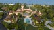 FILE - An aerial view of President Donald Trump's Mar-a-Lago estate is seen Wednesday, Aug. 10, 2022, in Palm Beach, Fla. Social media users are sharing a satirical post claiming a bank foreclosing on Mar-a-Lago club as real. (APPhoto/Steve Helber)