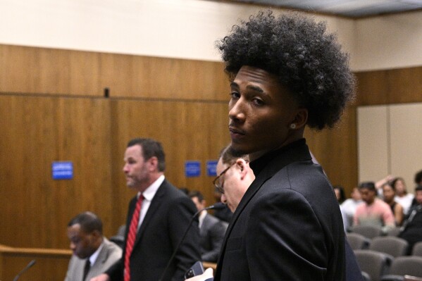 Mikey Williams looks on in court Friday, Oct. 27, 2023, in El Cajon, Calif. Star Memphis basketball recruit Mikey Williams is in Superior Court for arraignment on nine felony charges stemming from a March 27 shooting at his $1.2 million home. (AP Photo/Orlando Ramirez)