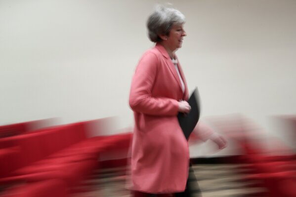 
              British Prime Minister Theresa May makes her way to a media conference at the conclusion of an EU-Arab League summit at the Sharm El Sheikh convention center in Sharm El Sheikh, Egypt, Monday, Feb. 25, 2019. British Prime Minister Theresa May stays convinced that March 29 remains a realistic Brexit date, despite the EU urging Britain to delay its departure from the bloc to avoid a chaotic rupture. (AP Photo/Francisco Seco)
            