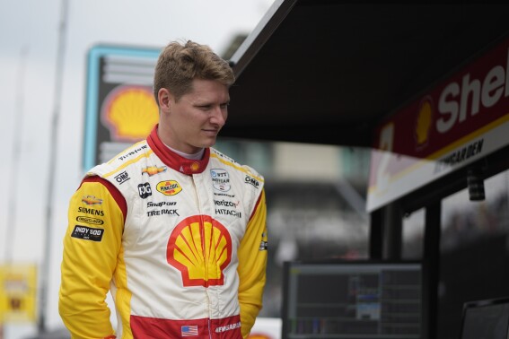 Josef Newgarden stands in his pit box during a practice session for the Indianapolis 500 auto race at Indianapolis Motor Speedway, Thursday, May 16, 2024, in Indianapolis. (AP Photo/Darron Cummings)