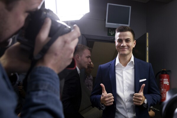 FILE - Far-right frontman and founder of Schild en Vrienden, Dries Van Langenhove gives the thumbs up as he arrives for a media conference of the far right Vlaams Belang Party in Brussels, Monday, May 27, 2019. A local court on Tuesday, March 12, 2024 convicted Van Langenhove to a year in jail for what the judge called "racist, hateful, Nazi and negationist speech" in a major ruling on how the nation deals with extremism. (AP Photo/Virginia Mayo, File)