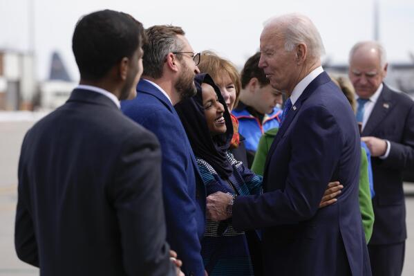 President Joe Biden hugs Rep. Ilhan Omar, D-Minn., as he is greeted at Minneapolis−Saint Paul International Airport, Monday, April 3, 2023, in Minneapolis. (AP Photo/Carolyn Kaster)