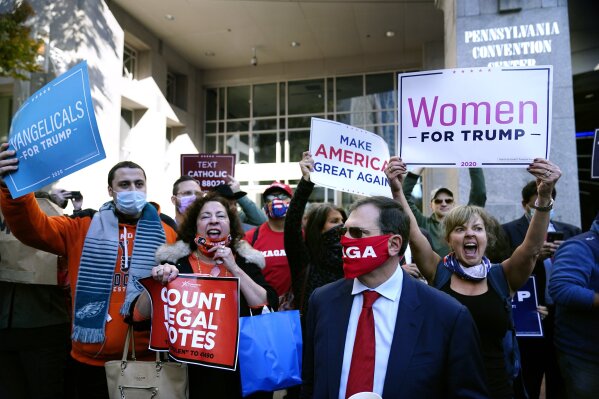Demonstrators march to urge that all votes be counted outside the Pennsylvania Convention Center, Thursday, Nov. 5, 2020, in Philadelphia, following Tuesday's election. (AP Photo/Matt Slocum)