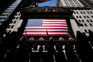 FILE - People walk past the New York Stock Exchange on Wednesday, June 29, 2022 in New York. Wall Street's best week of the year is getting even better Friday, Nov. 3, 2023, following a cooler-than-expected report on the job market. (AP Photo/Julia Nikhinson)