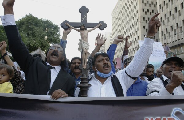 Christians demonstrate against child marriage and forced conversion, in Karachi, Pakistan, on Sunday, Nov. 8, 2020. Nearly 1,000 non-Muslim girls are forced to convert to Islam in Pakistan each year, largely to pave the way for marriages that are under the legal age and non-consensual. (AP Photo/Fareed Khan)