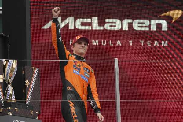 McLaren driver Oscar Piastri of Australia celebrates on the podium after winning the Chinese Formula One Grand Prix race at the Shanghai International Circuit, Shanghai, Sunday, March 23, 2025. (AP Photo/Andy Wong)