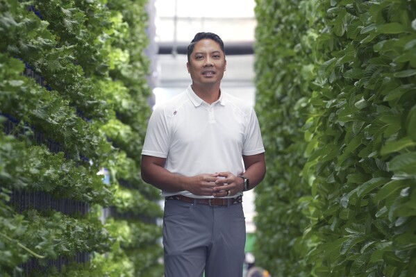 Eden Green Technology chief executive officer Eddy Badrina poses for a photo in a greenhouse in Cleburne, Texas, Aug. 29, 2023. (AP Photo/LM Otero)